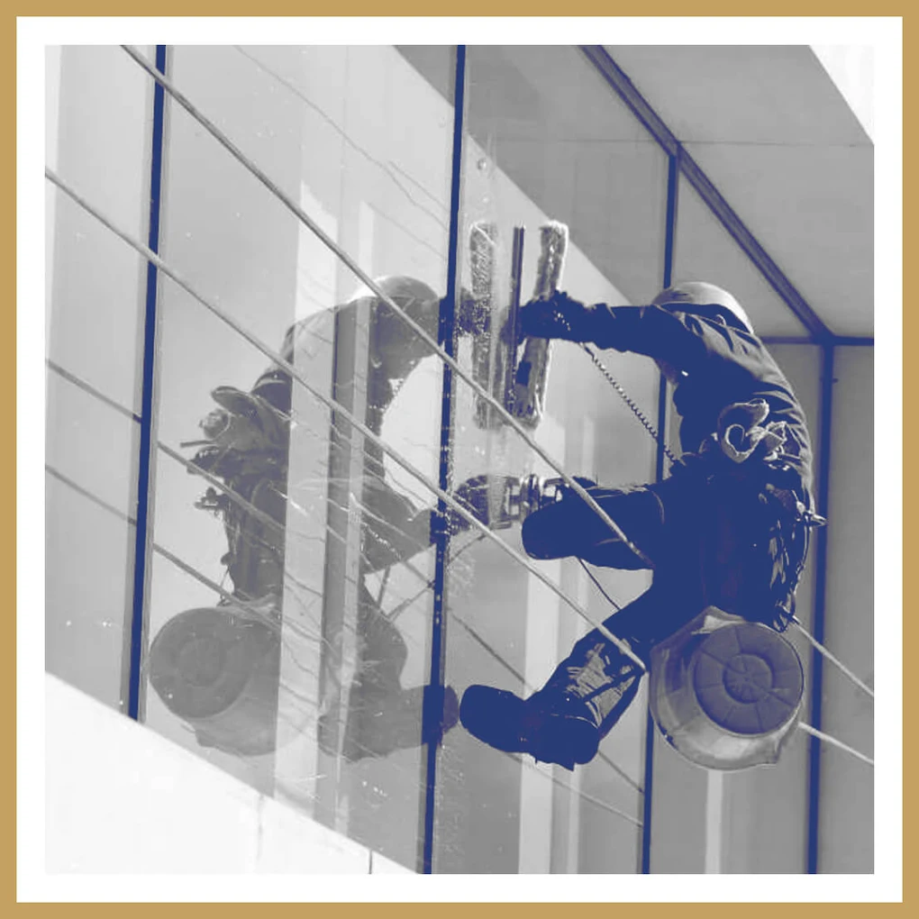 Nationwide Maintenance high-rise window cleaning technician on rope access — over 30 years serving the Tri-State